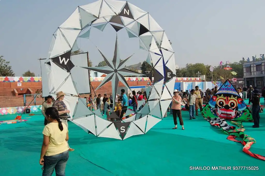 Man in suit speaking at podium with ITT logo on podium