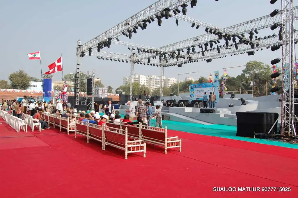 Man in suit speaking at podium with ITT logo on podium