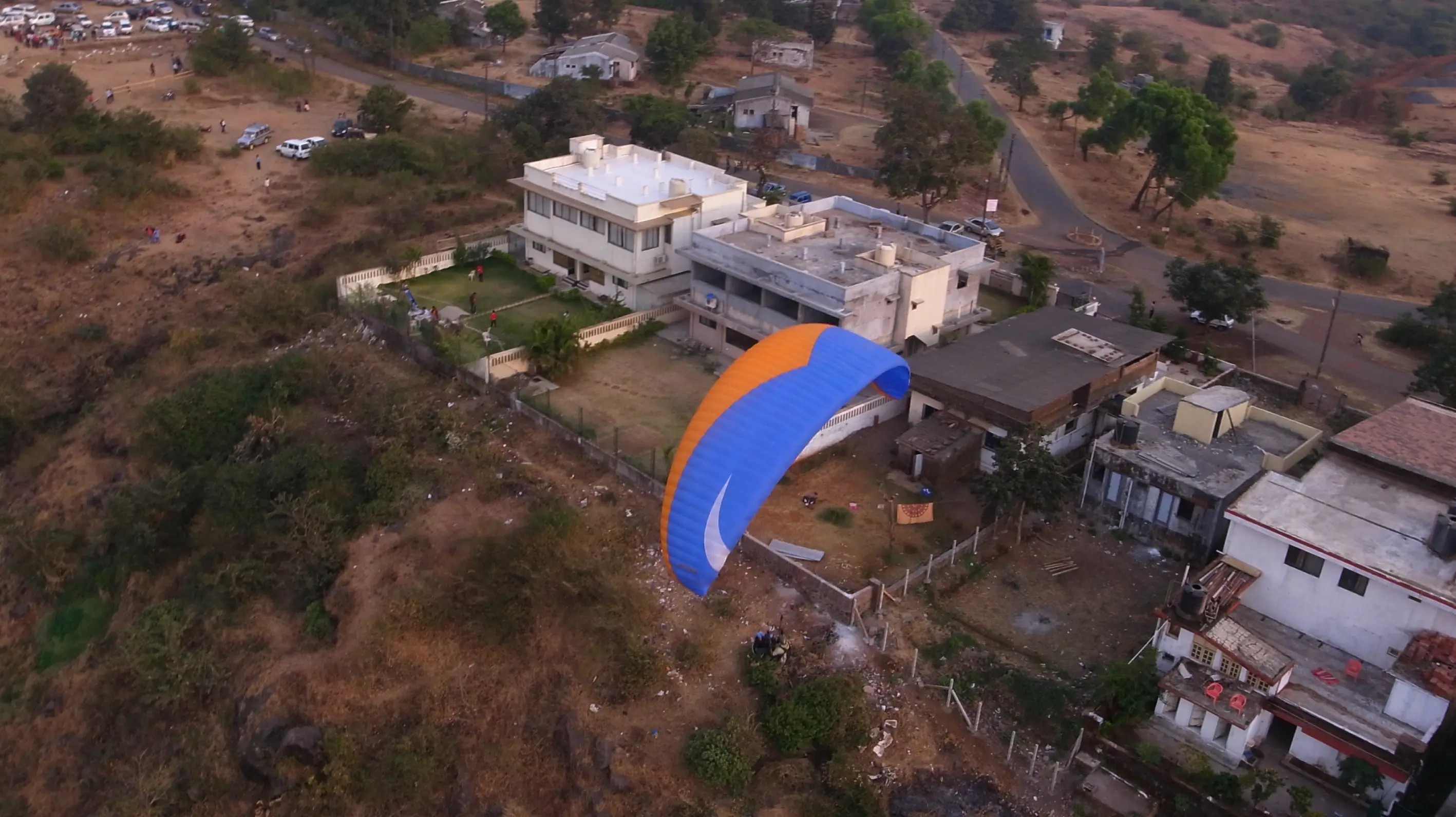 ITT event entrance with red and green carpet and pink lighting on white structure with ITT branding